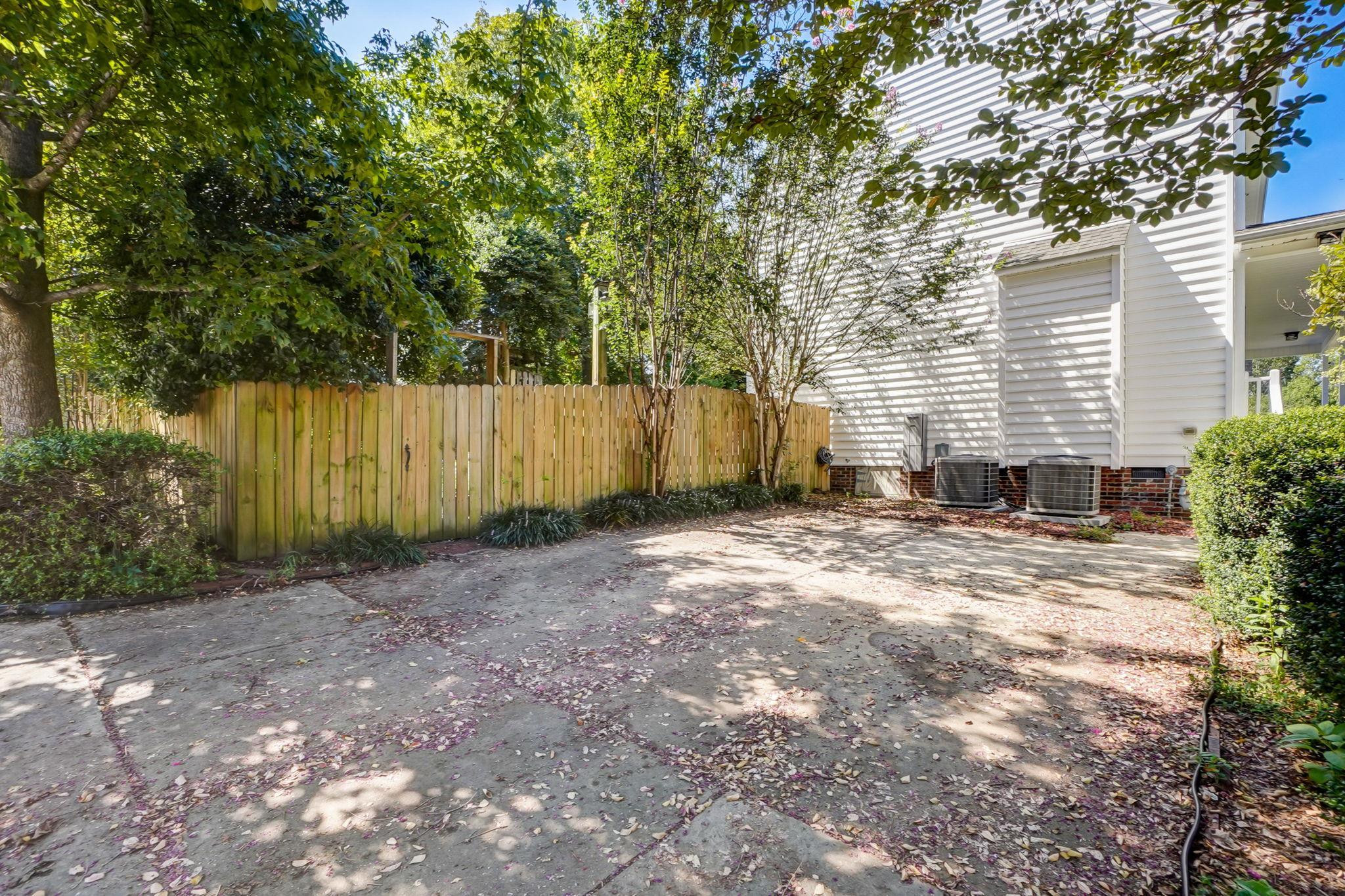 4816 Elmhurst Ridge Court Raleigh, NC 27616 - Photo 24 of 27 a backyard of a house with lots of green space