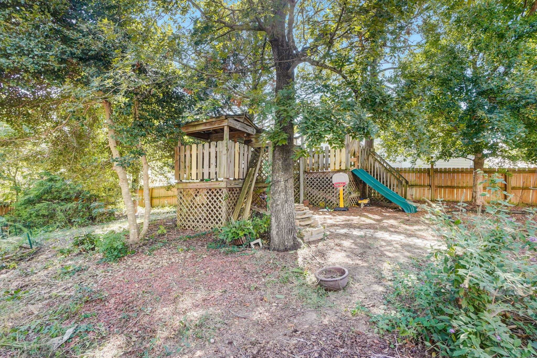 4816 Elmhurst Ridge Court Raleigh, NC 27616 - Photo 26 of 27 a view of a house with a yard and a tree