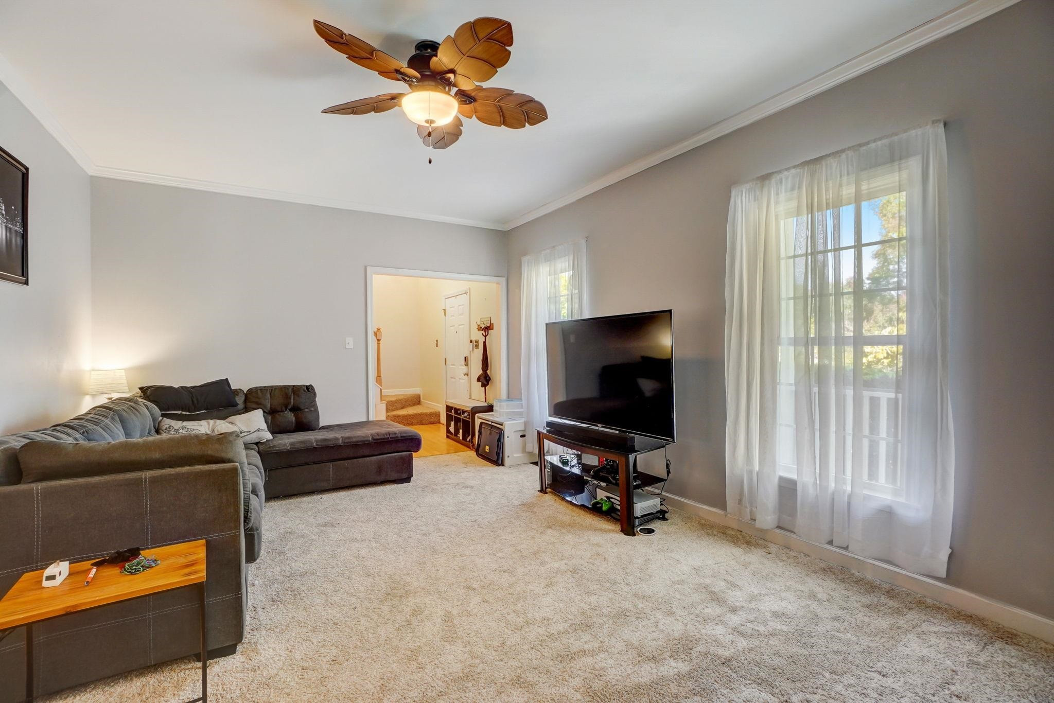 4816 Elmhurst Ridge Court Raleigh, NC 27616 - Photo 3 of 27 a view of a livingroom with workspace and a window