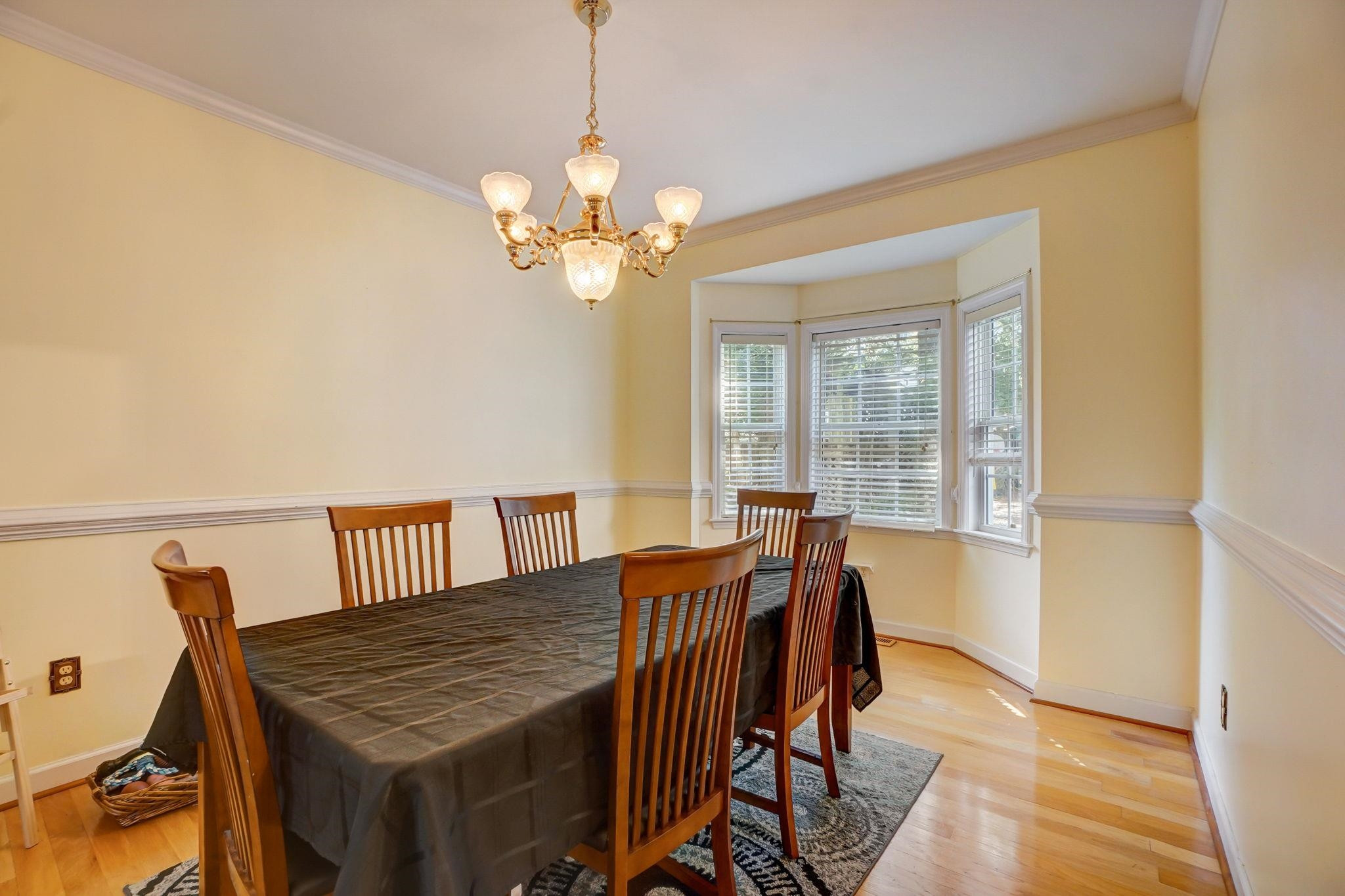 4816 Elmhurst Ridge Court Raleigh, NC 27616 - Photo 4 of 27 a view of a dining room with furniture window and wooden floor