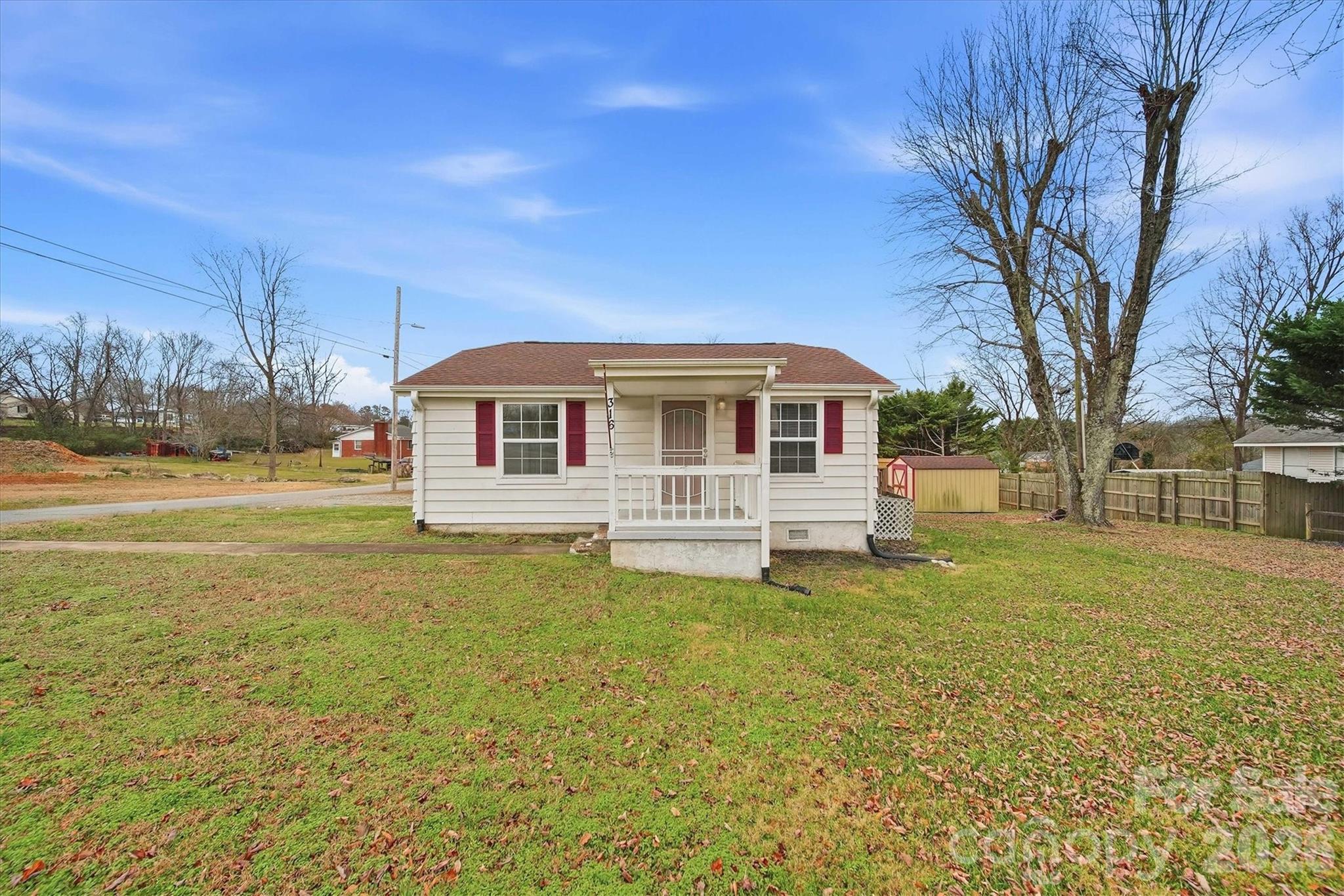 a house view with swimming pool in front of it