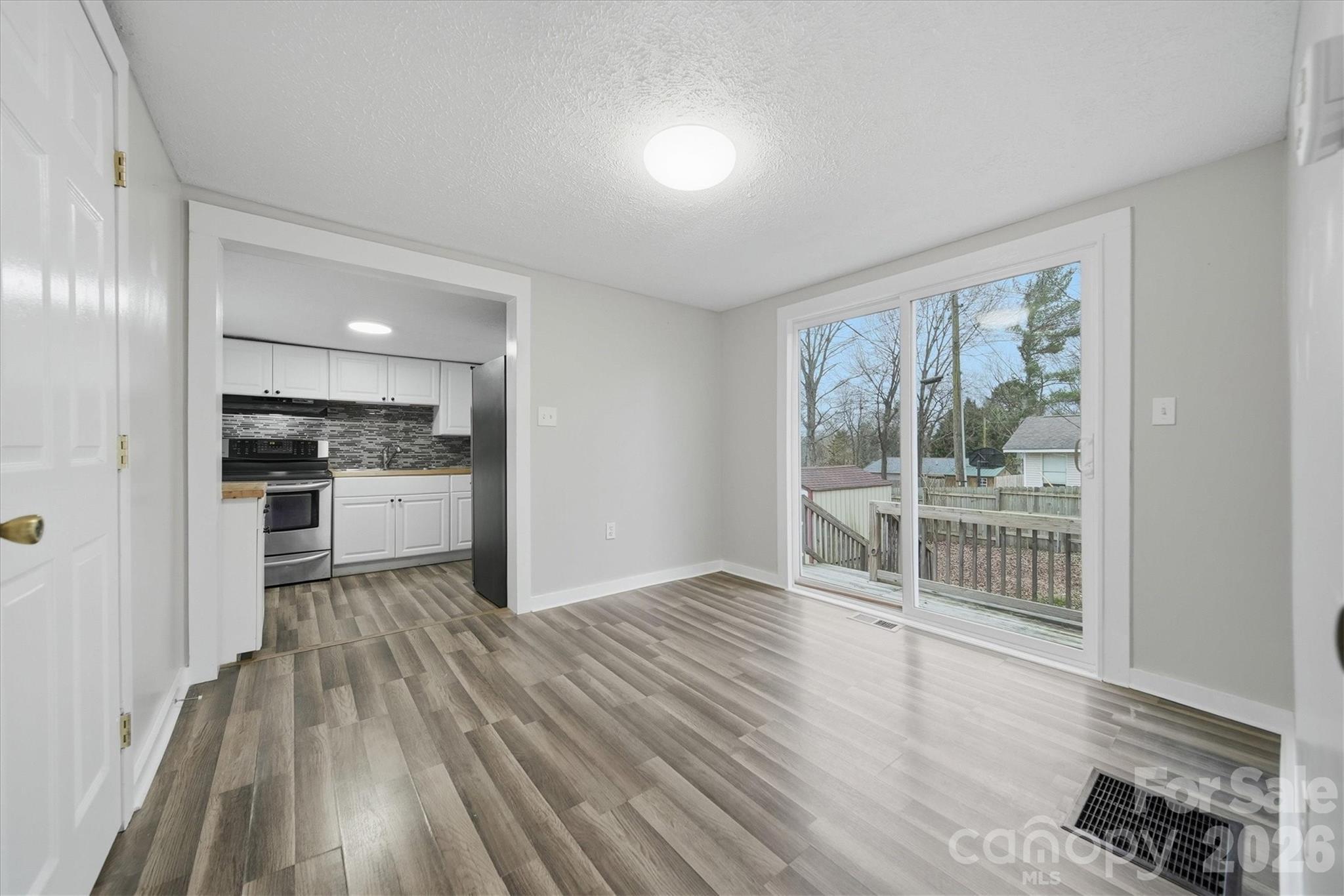 316 23rd Street Northwest Hickory, NC 28601 - Photo 6 of 15 a view of a kitchen with wooden floor and a kitchen