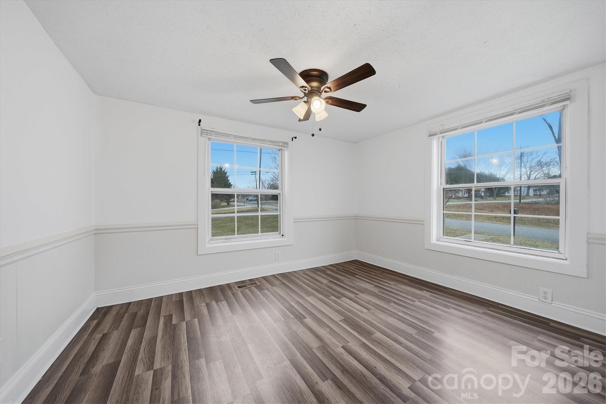 316 23rd Street Northwest Hickory, NC 28601 - Photo 10 of 15 a view of an empty room with wooden floor and a window