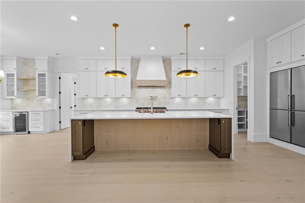 2865 Old Fountain Road Dacula, GA 30019 - Photo 12 of 84 a kitchen with counter top space cabinets and stainless steel appliances