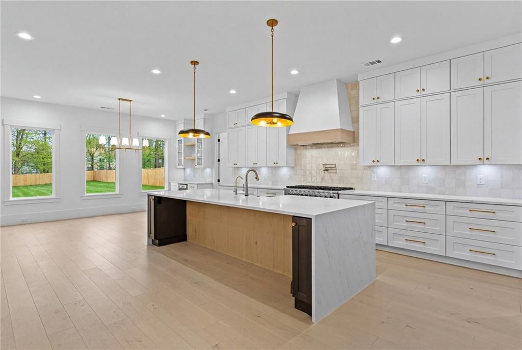 2865 Old Fountain Road Dacula, GA 30019 - Photo 13 of 84 a kitchen with counter top space cabinets and appliances