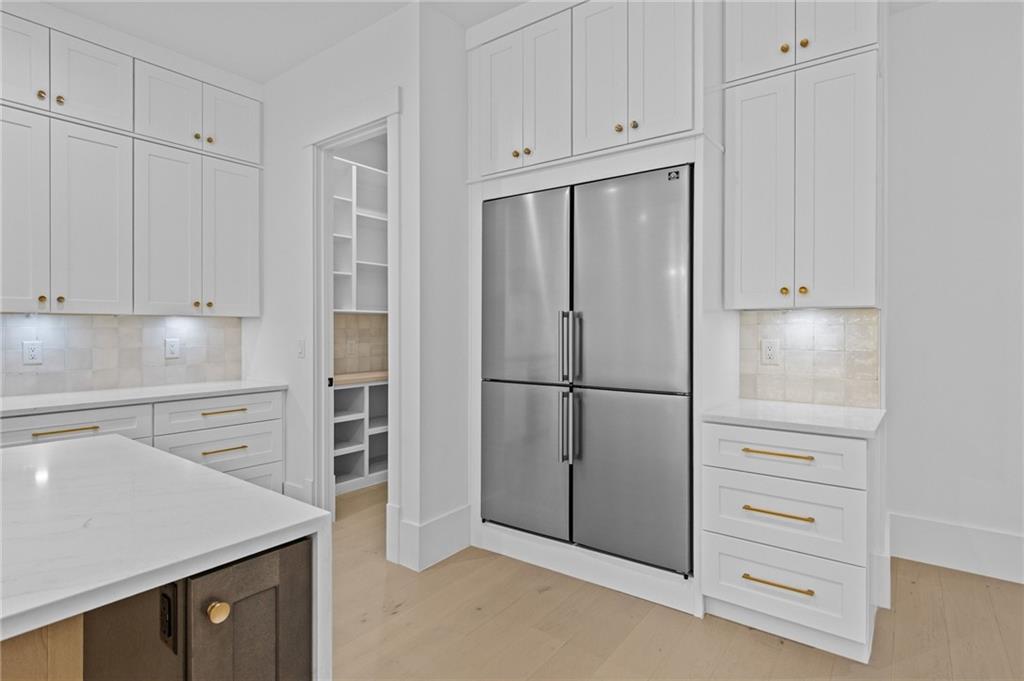 2865 Old Fountain Road Dacula, GA 30019 - Photo 19 of 84 a kitchen with refrigerator and cabinets