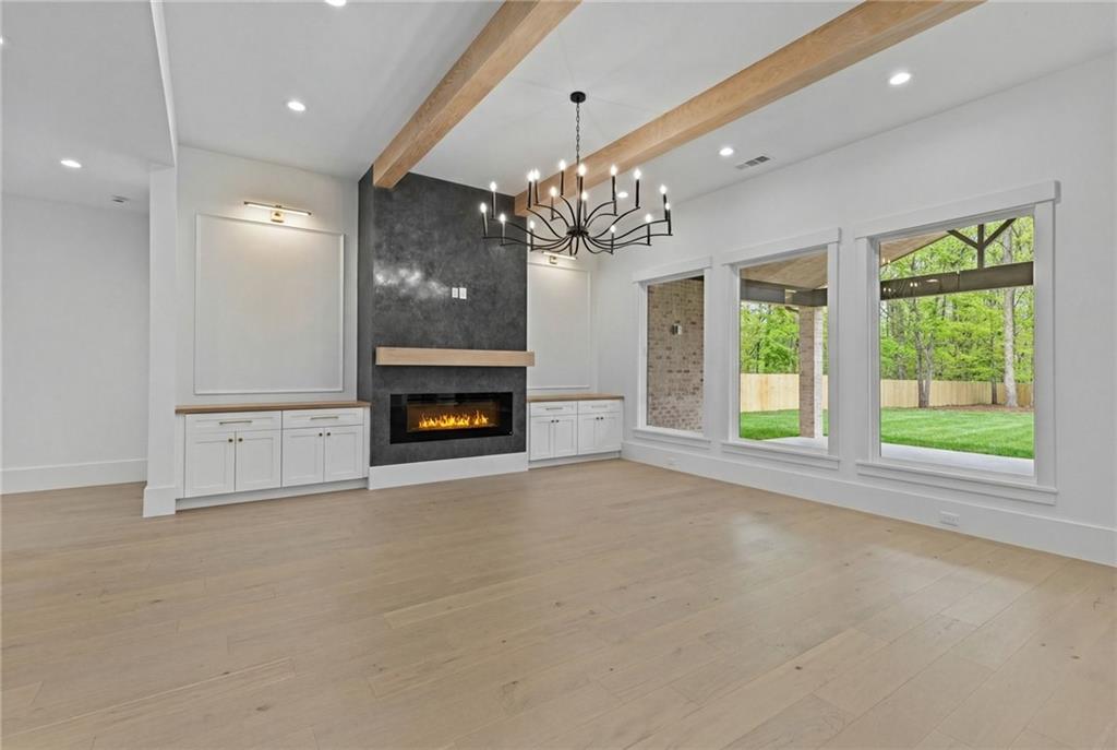 2865 Old Fountain Road Dacula, GA 30019 - Photo 23 of 84 a view of an empty room with a window and fireplace