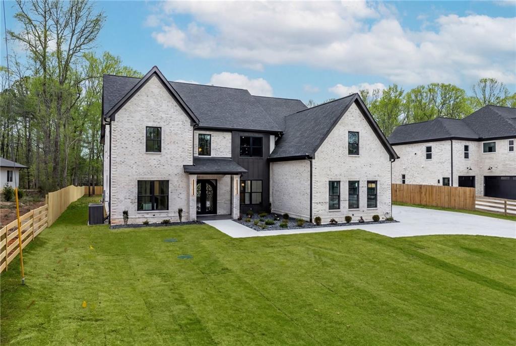 2865 Old Fountain Road Dacula, GA 30019 - Photo 3 of 84 a view of a house with a yard porch and sitting area