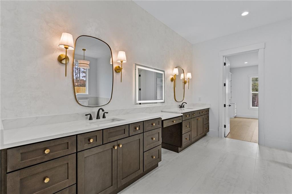 2865 Old Fountain Road Dacula, GA 30019 - Photo 37 of 84 a spacious bathroom with a double vanity sink double and mirror