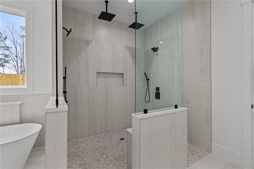 2865 Old Fountain Road Dacula, GA 30019 - Photo 38 of 84 a bathroom with a sink a toilet and shower