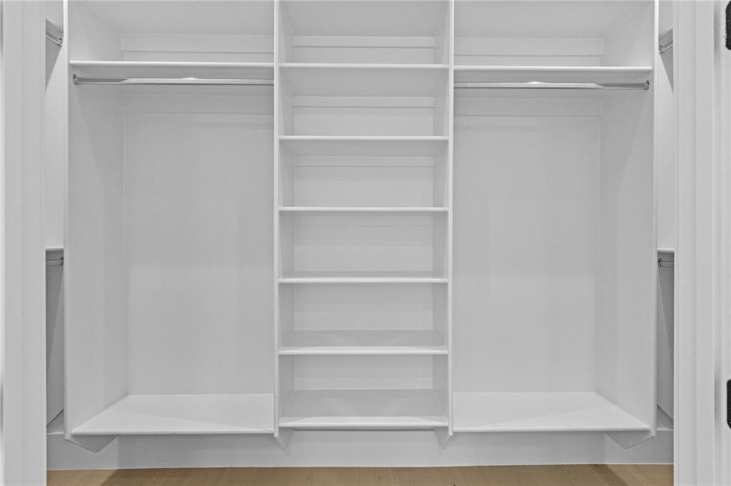 2865 Old Fountain Road Dacula, GA 30019 - Photo 44 of 84 a view of walk in closet with empty racks