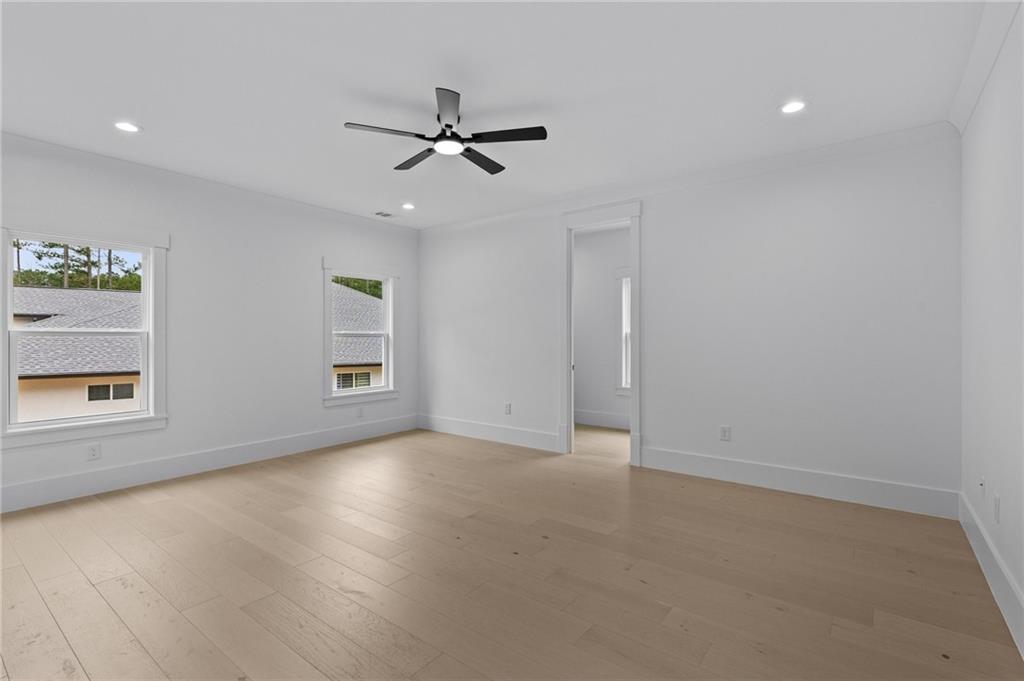2865 Old Fountain Road Dacula, GA 30019 - Photo 55 of 84 an empty room with a window and a fan