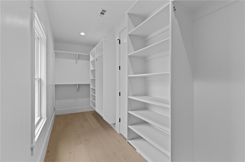 2865 Old Fountain Road Dacula, GA 30019 - Photo 59 of 84 a view of walk in closet with empty racks