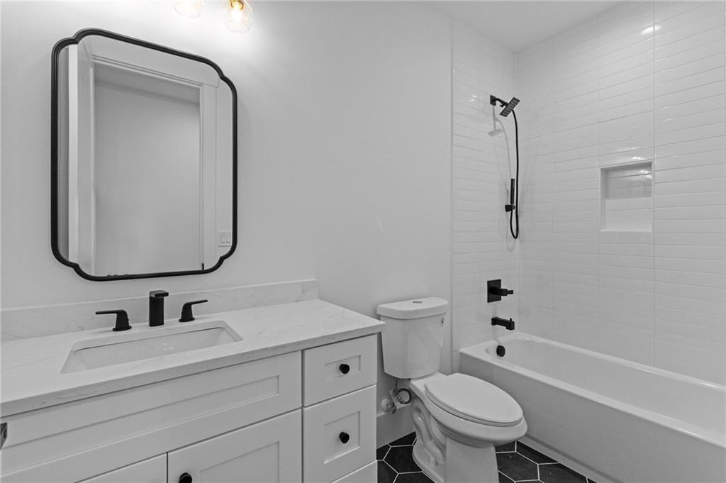 2865 Old Fountain Road Dacula, GA 30019 - Photo 70 of 84 a bathroom with a sink toilet and shower