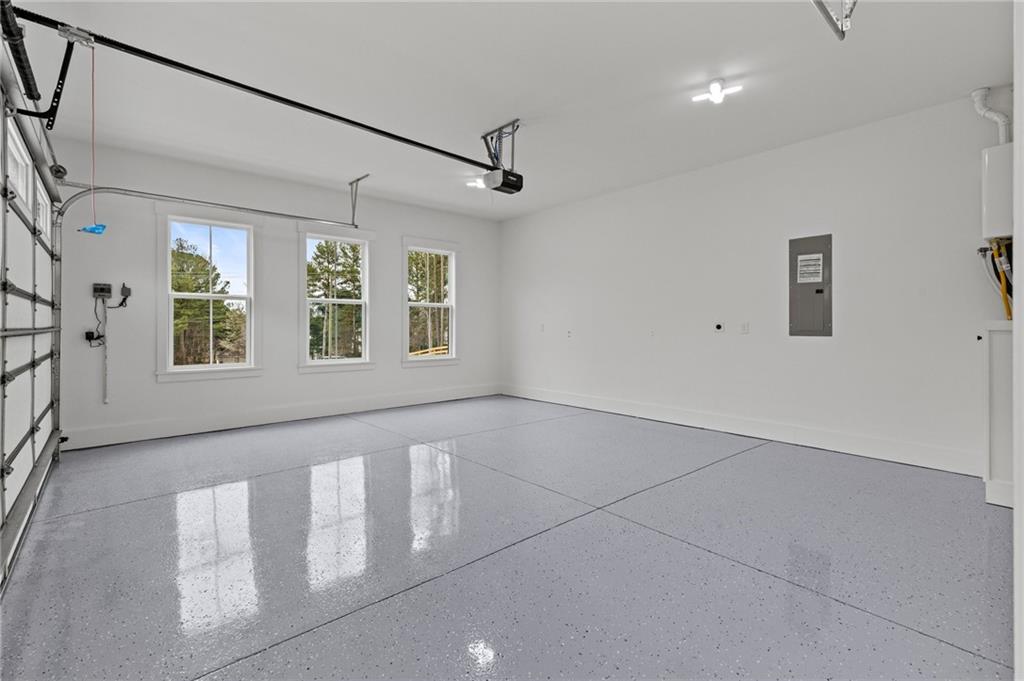 2865 Old Fountain Road Dacula, GA 30019 - Photo 74 of 84 a view of an empty room with windows