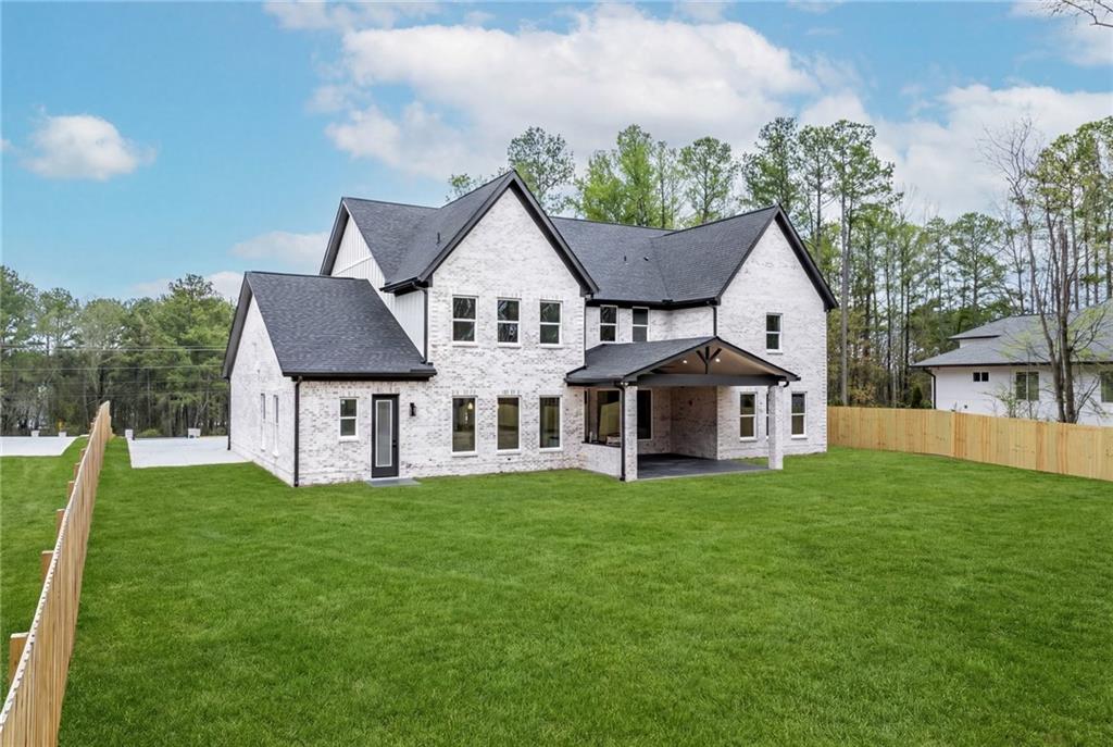 2865 Old Fountain Road Dacula, GA 30019 - Photo 81 of 84 a view of a house with a yard and sitting area