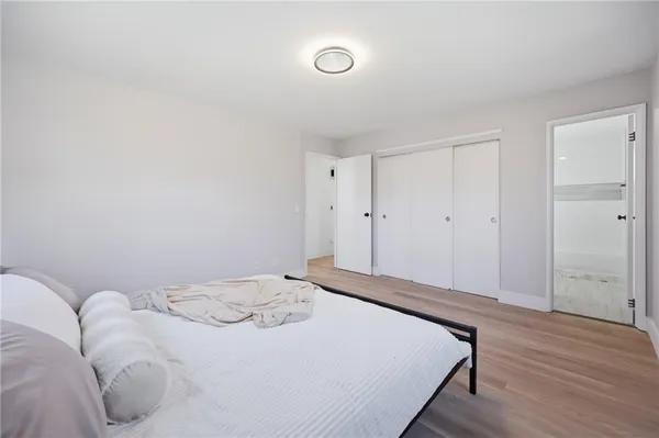 a bathroom with a bathtub shower sink vanity and toilet