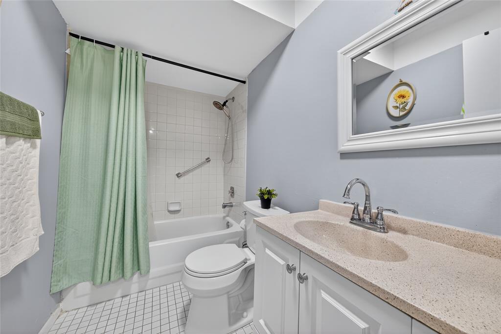 10145 Sunrise Lakes Boulevard, Unit 406 Sunrise, FL 33322 - Photo 11 of 37 a bathroom with a sink a toilet and shower
