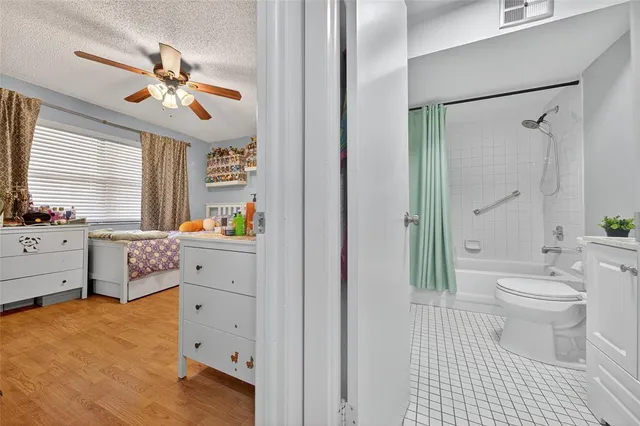 a spacious bathroom with a double vanity sink a mirror and a bathtub