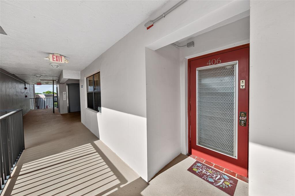 10145 Sunrise Lakes Boulevard, Unit 406 Sunrise, FL 33322 - Photo 14 of 37 a view of a hallway with closet