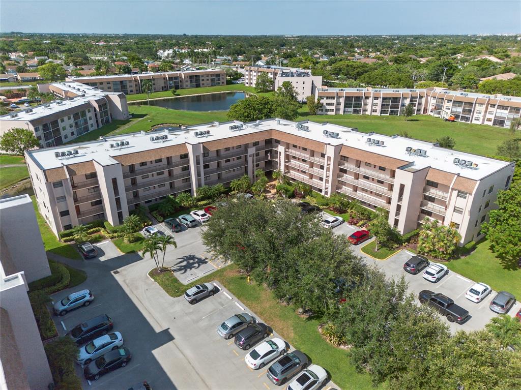 10145 Sunrise Lakes Boulevard, Unit 406 Sunrise, FL 33322 - Photo 2 of 37 a view of a city from a terrace