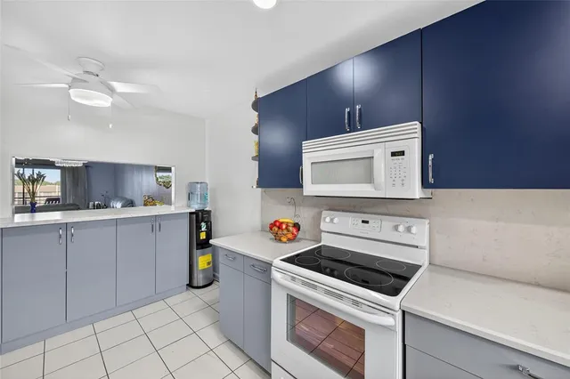 a kitchen with a stove and a microwave