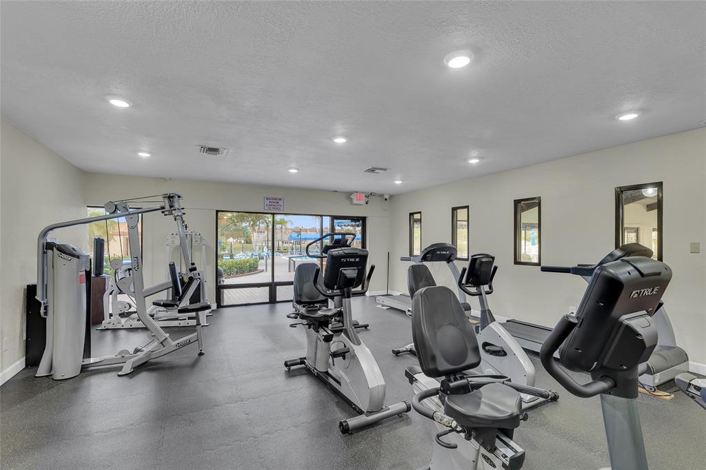 10145 Sunrise Lakes Boulevard, Unit 406 Sunrise, FL 33322 - Photo 28 of 37 a view of a room with gym equipment