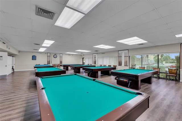a room with furniture and pool table