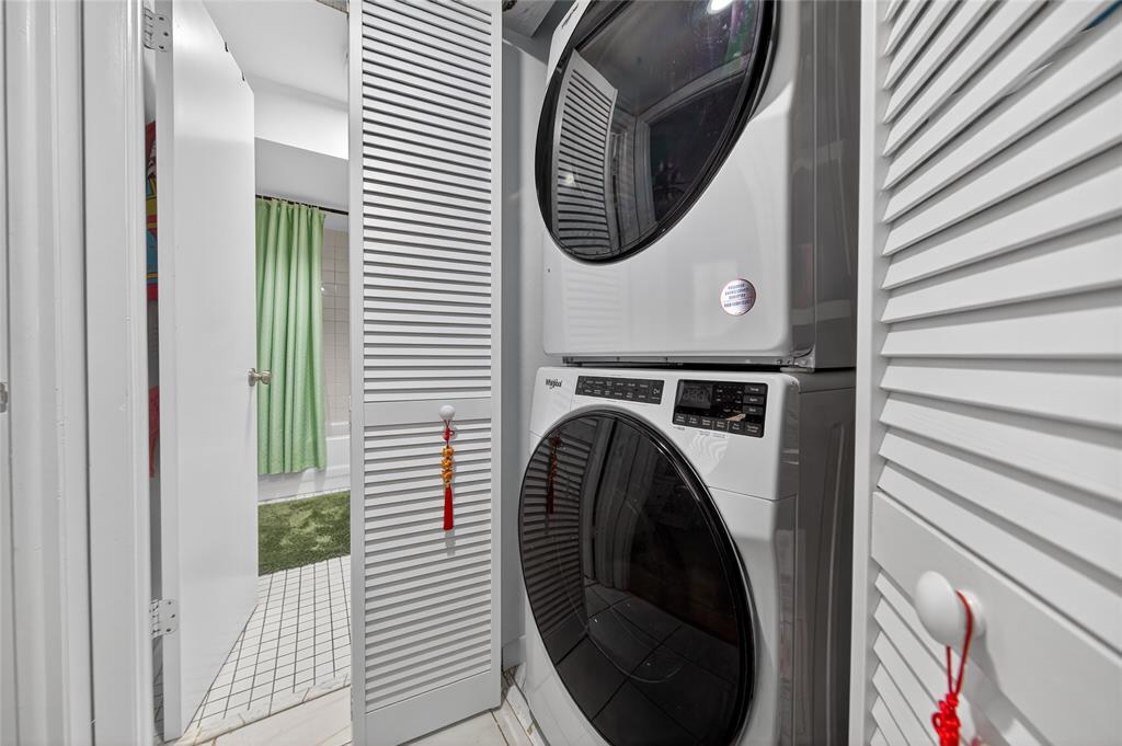 10145 Sunrise Lakes Boulevard, Unit 406 Sunrise, FL 33322 - Photo 4 of 37 a view of a hallway with washer and dryer
