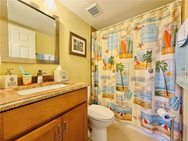 a bedroom with two beds and a window