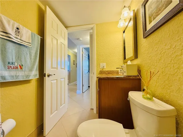 a bedroom with a bed and ceiling fan