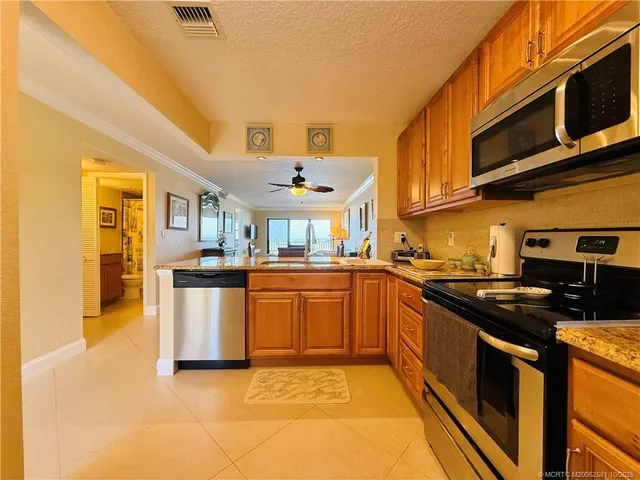 a view of a dining room with furniture and window