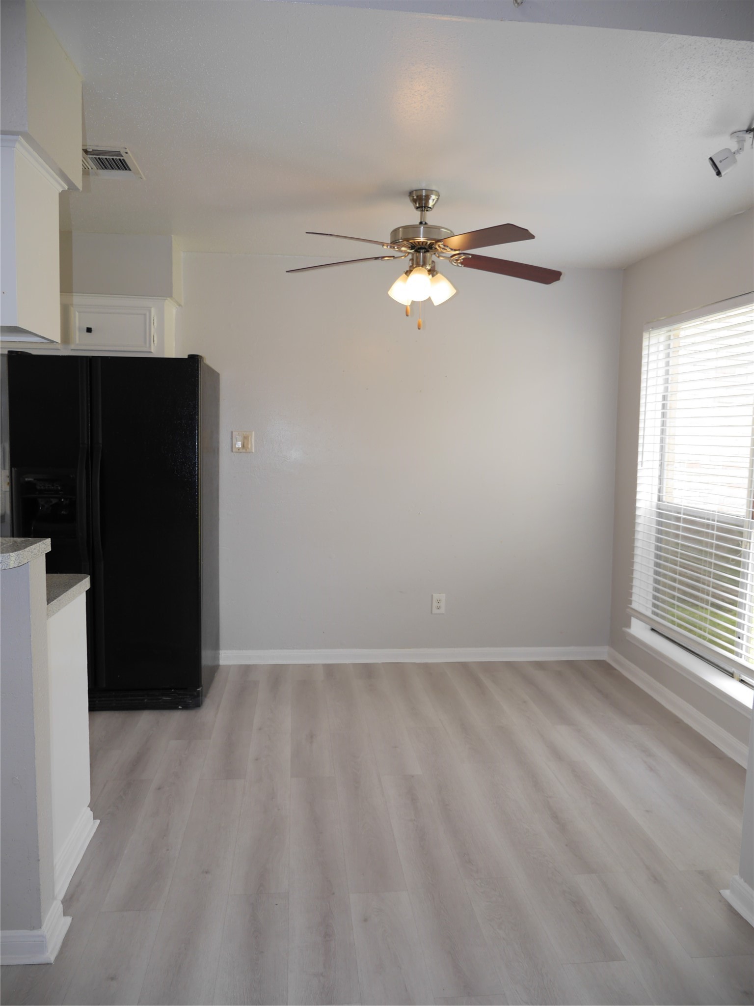 7410 Canasta Lane Houston, TX 77083 - Photo 12 of 33 wooden floor in an empty room with a window