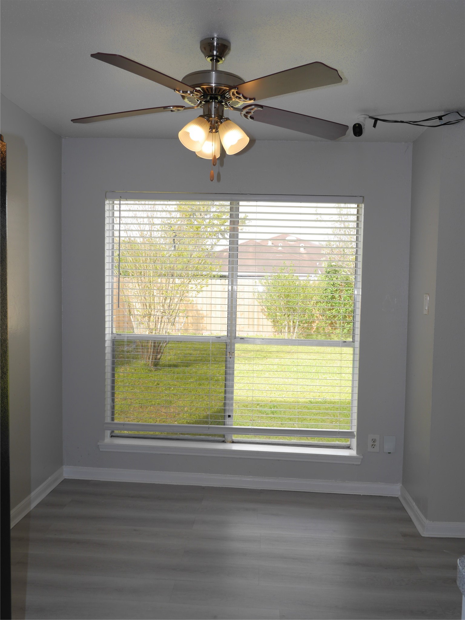 7410 Canasta Lane Houston, TX 77083 - Photo 13 of 33 a view of an empty room with wooden floor and a window