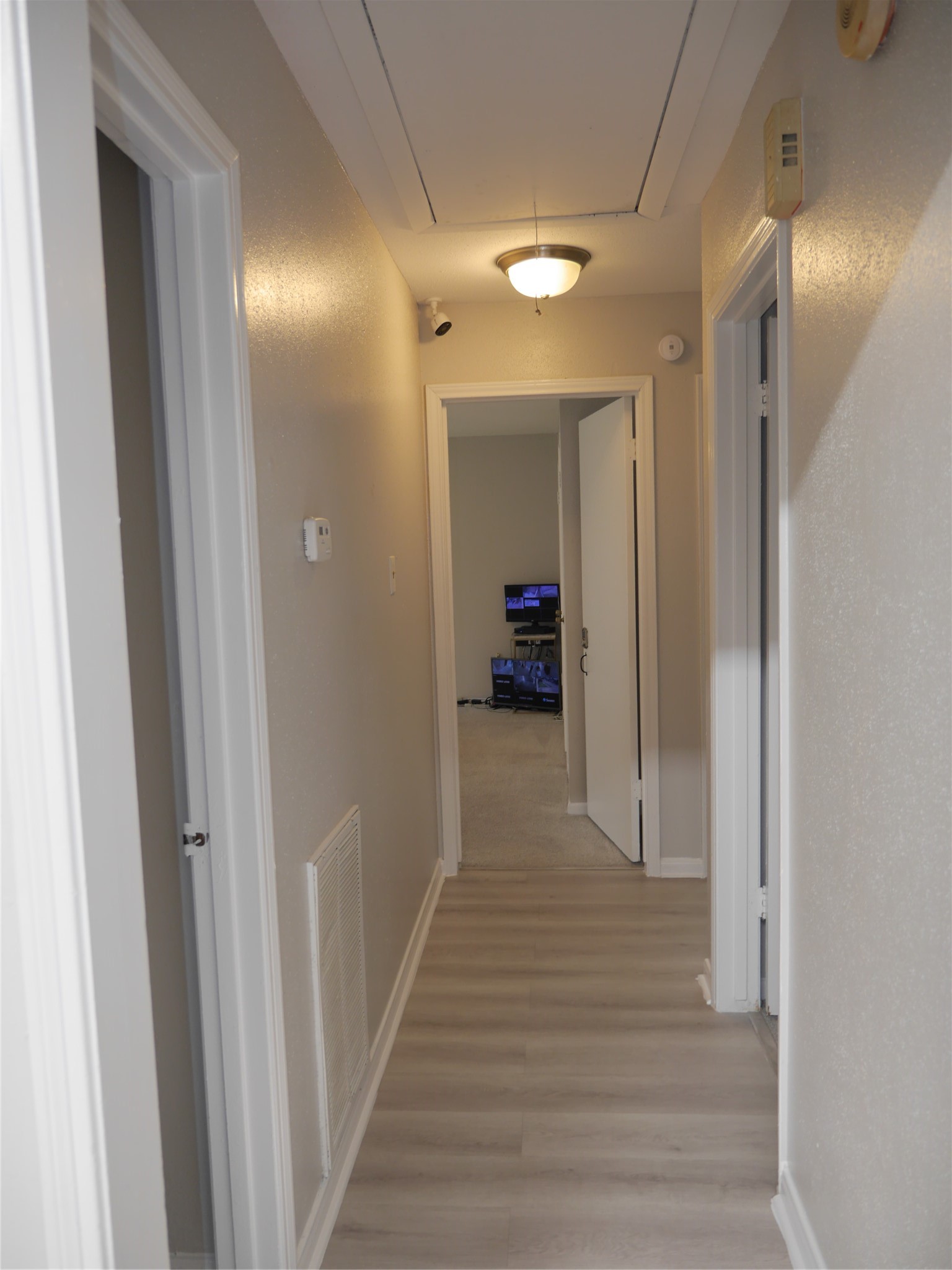 7410 Canasta Lane Houston, TX 77083 - Photo 20 of 33 a view of a hallway with wooden floor