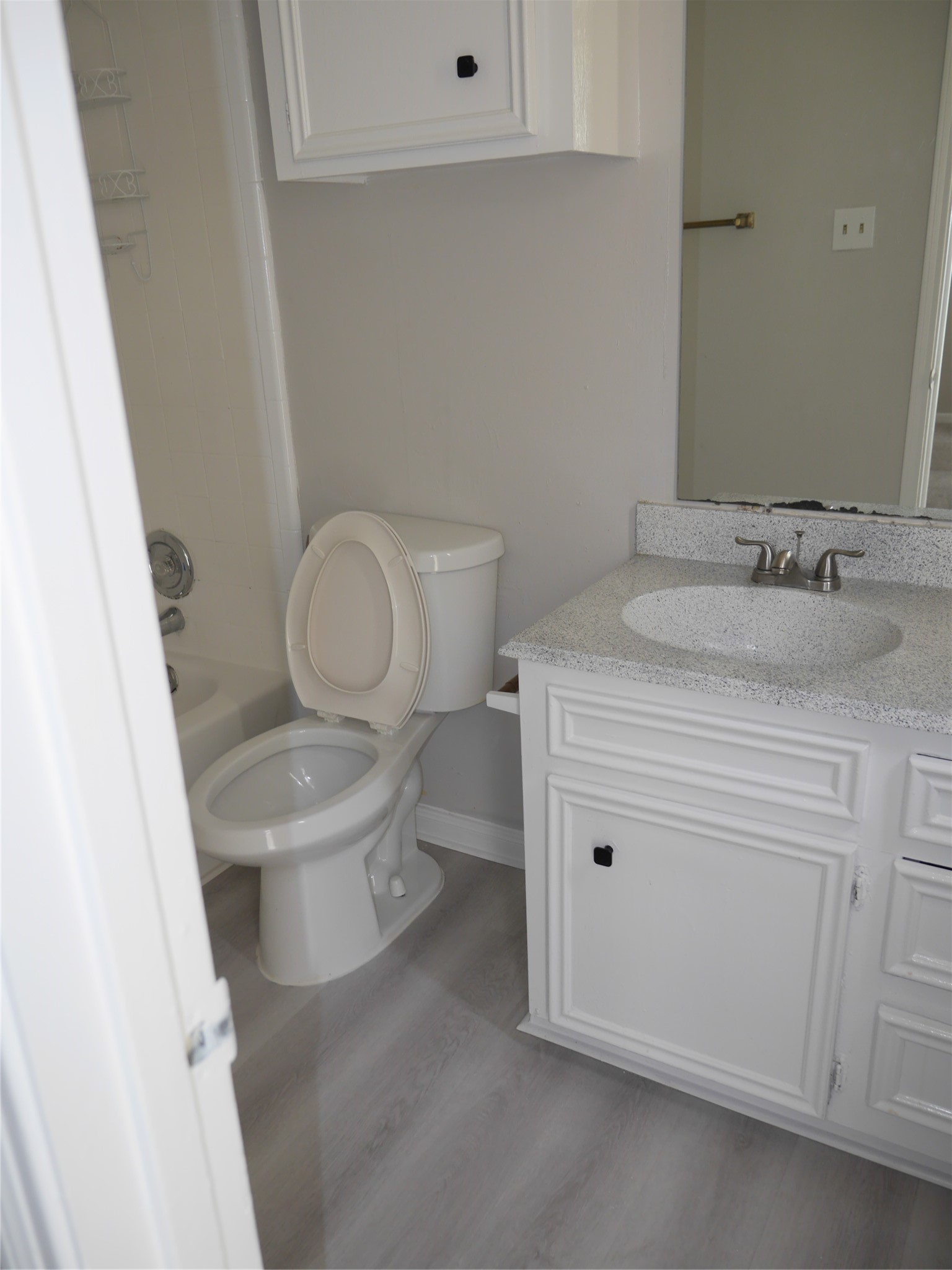 7410 Canasta Lane Houston, TX 77083 - Photo 26 of 33 a white toilet sitting next to a bathroom sink