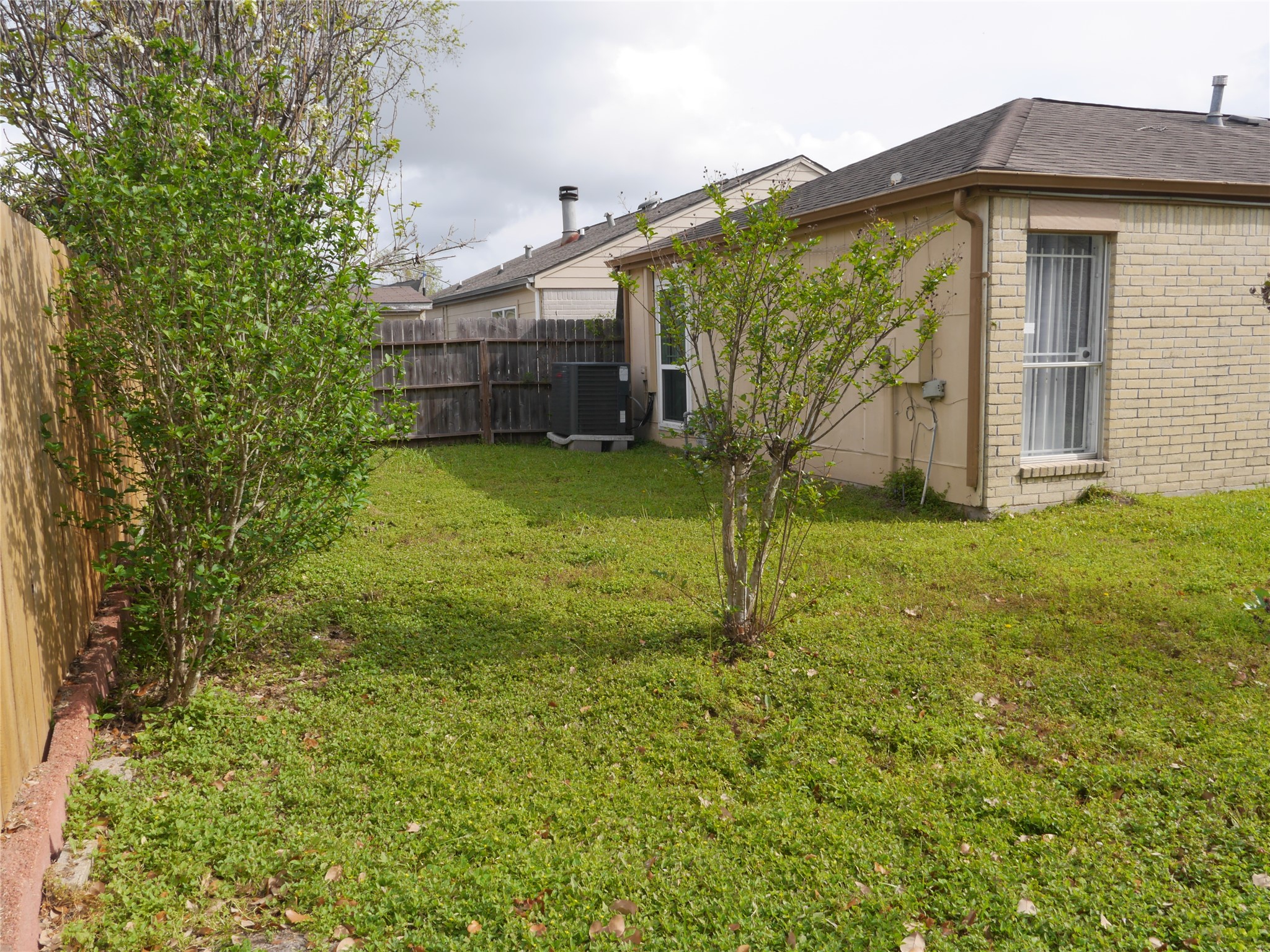 7410 Canasta Lane Houston, TX 77083 - Photo 31 of 33 a view of a house with a backyard