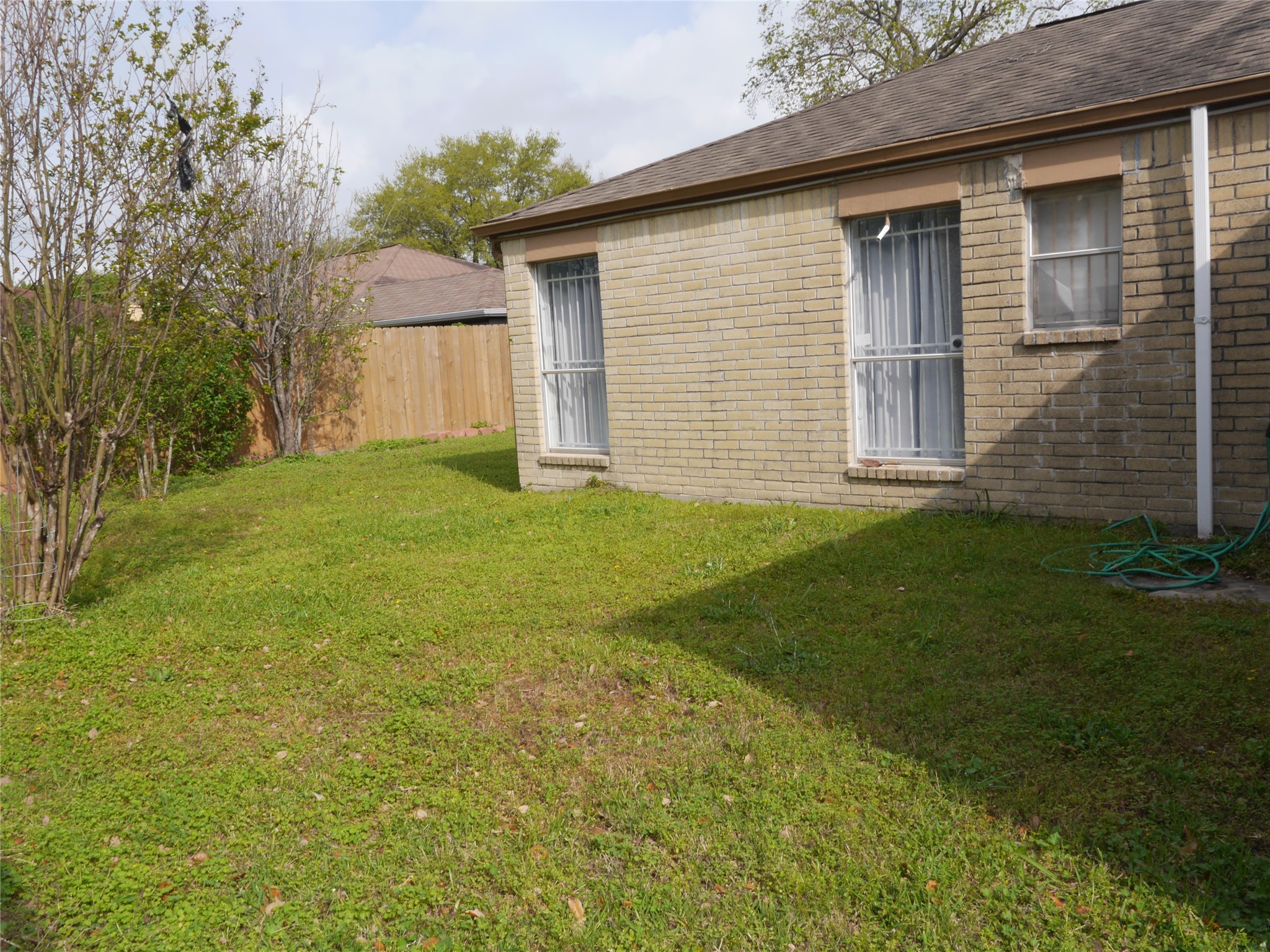 7410 Canasta Lane Houston, TX 77083 - Photo 32 of 33 a front view of a house with a yard and garage