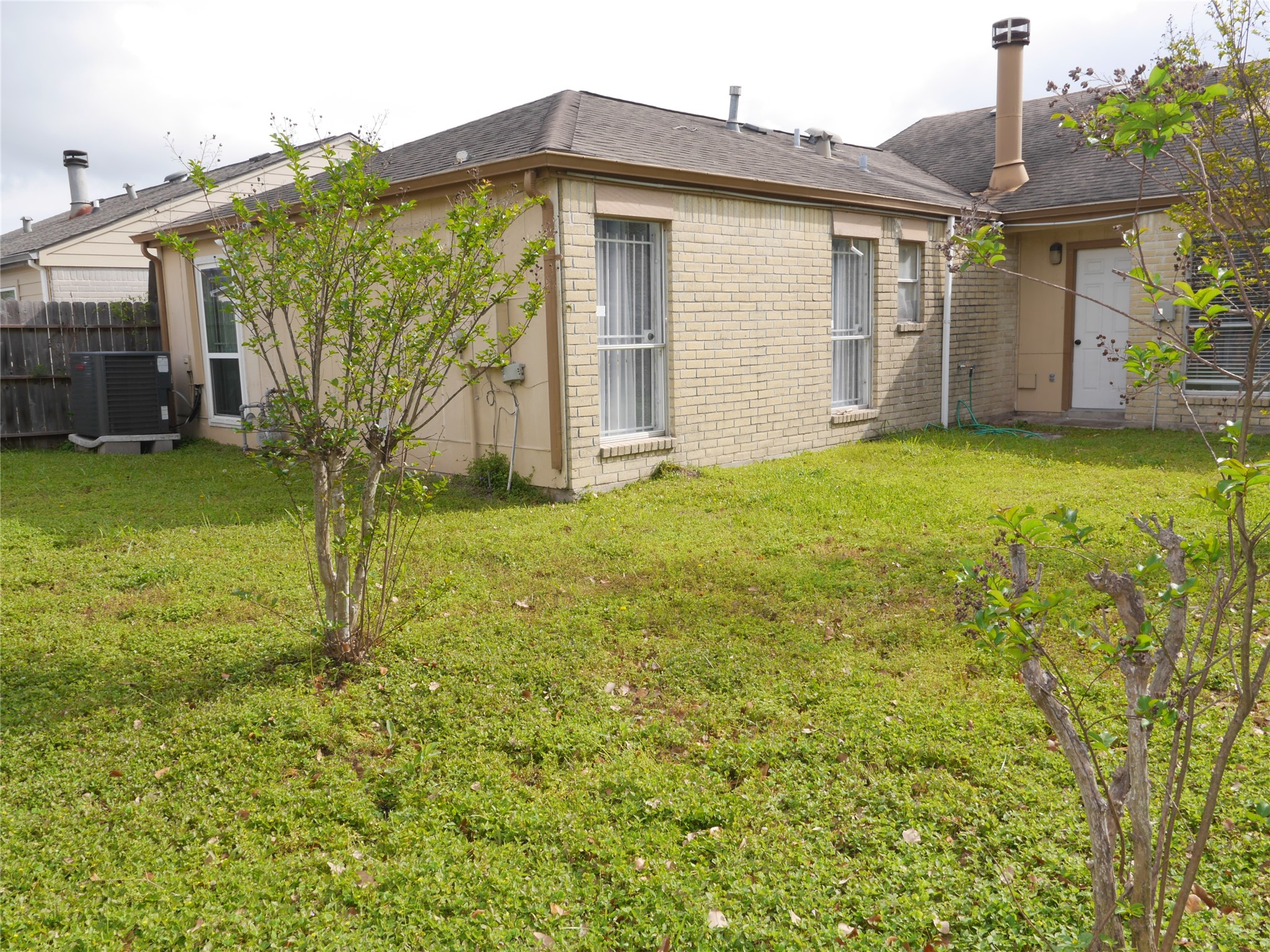 7410 Canasta Lane Houston, TX 77083 - Photo 33 of 33 a view of a house with backyard and garden