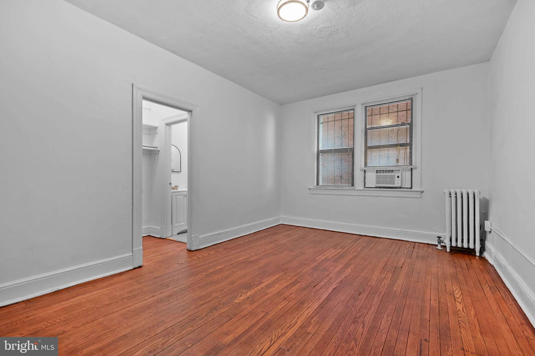 1457 Park Road Northwest, Unit 107 Washington, DC 20010 - Photo 23 of 42 Unit 105 angled view of the room closet and the b
