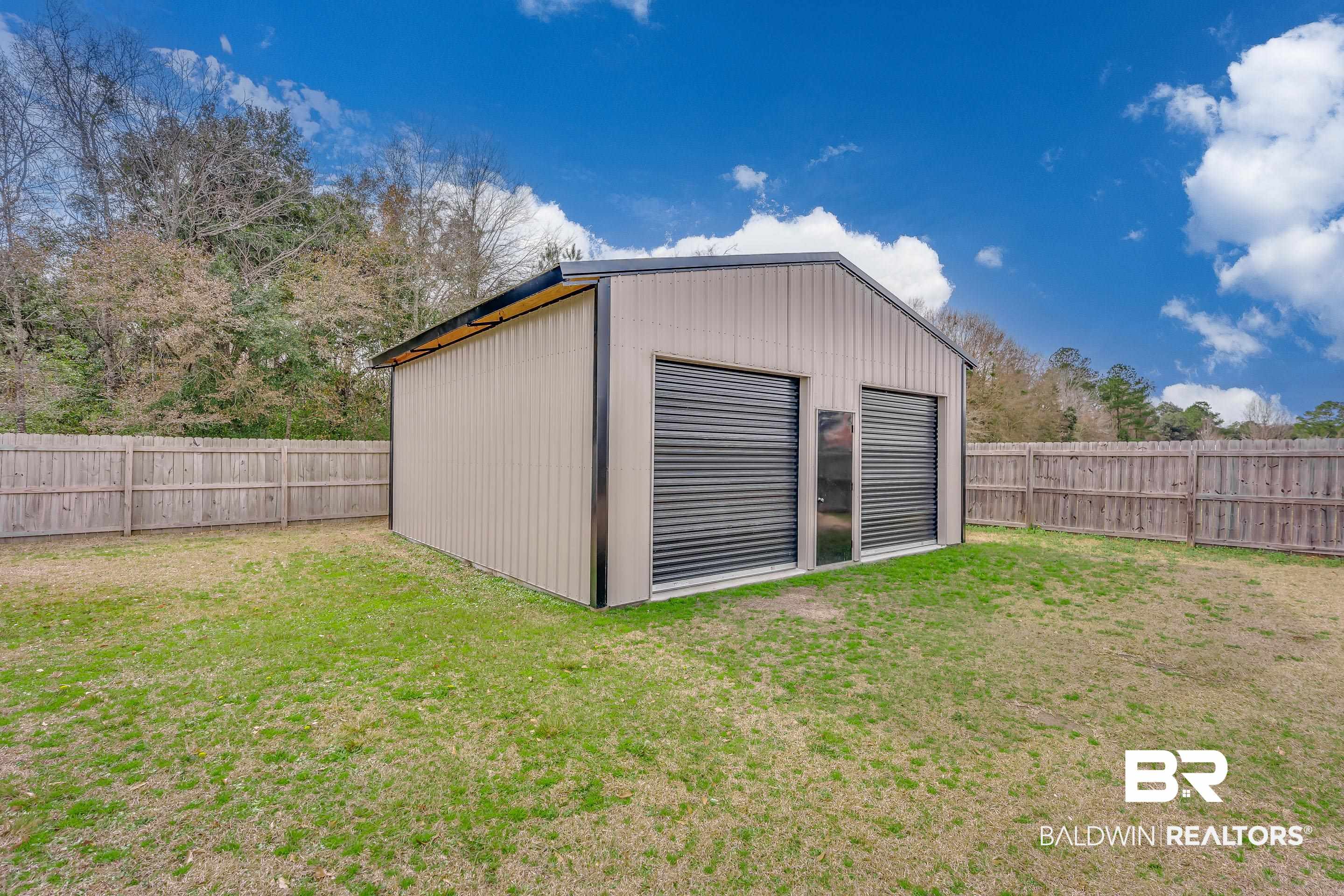 13235 Tom Gaston Road Mobile, AL 36695 - Photo 28 of 43 View of outdoor structure with a lawn
