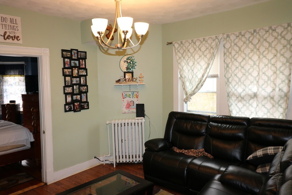 9 Whitby Street Boston, MA 02128 - Photo 6 of 15 a living room with furniture and wooden floor