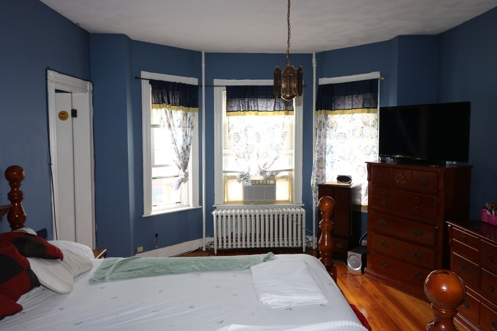 9 Whitby Street Boston, MA 02128 - Photo 7 of 15 a bedroom with windows