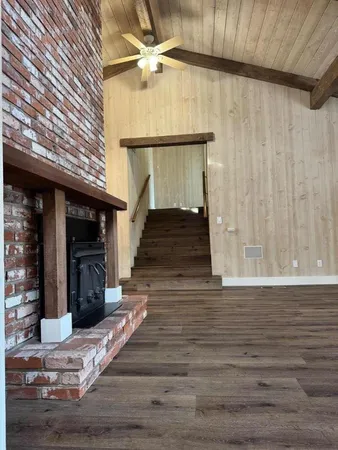 a view of an entryway with wooden floor
