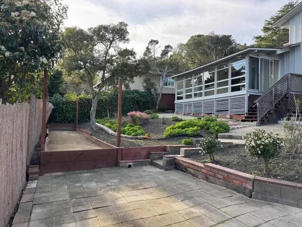 a backyard of a house with lots of green space