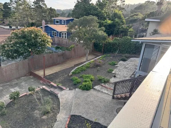 a view of a chairs and table in the patio