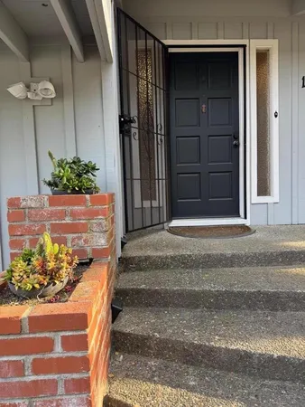 a view of a house with a flower garden