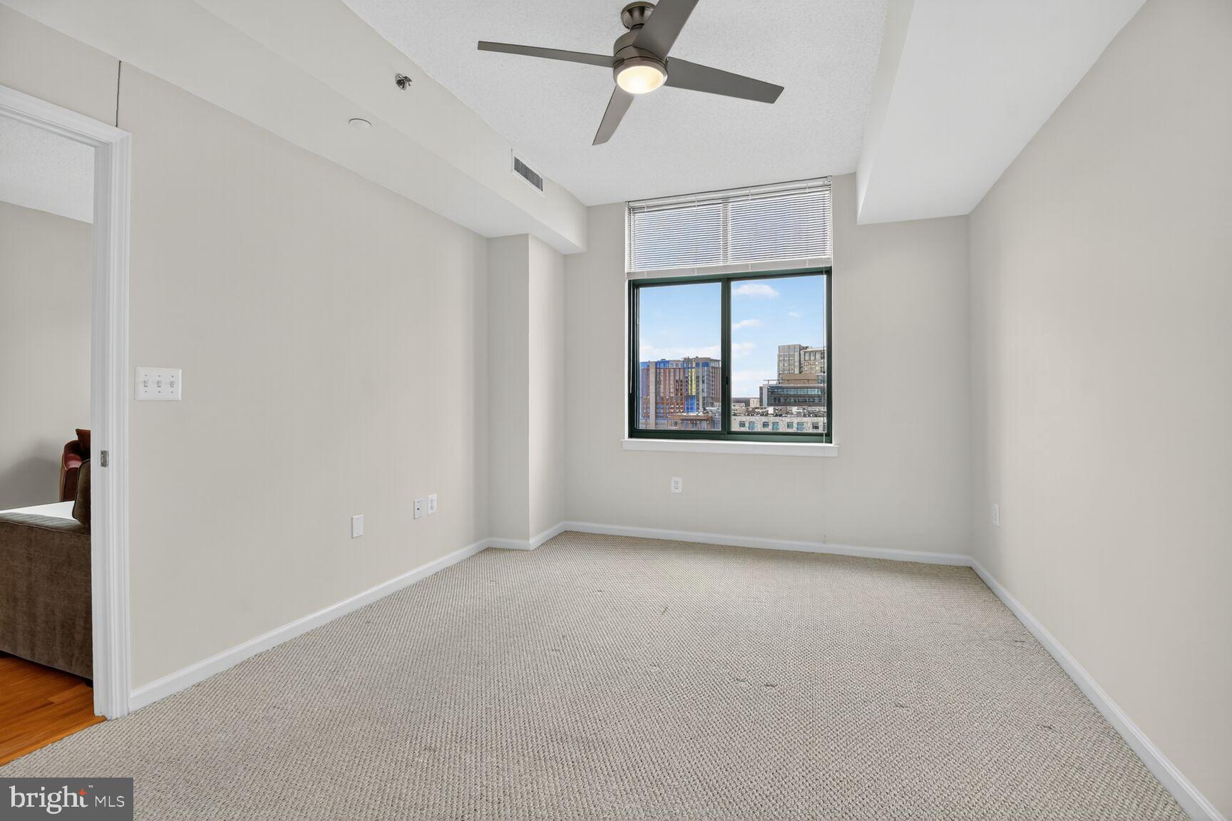 11700 Old Georgetown Road, Unit 714 Rockville, MD 20852 - Photo 11 of 21 an empty room with windows and fan