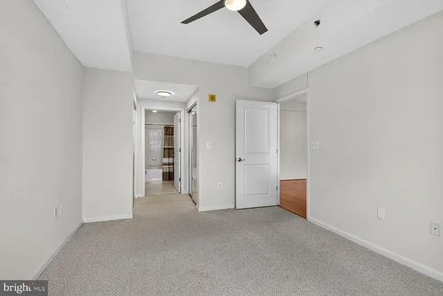 a bathroom with a sink toilet a mirror and shower