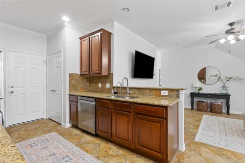 a living room with furniture and windows